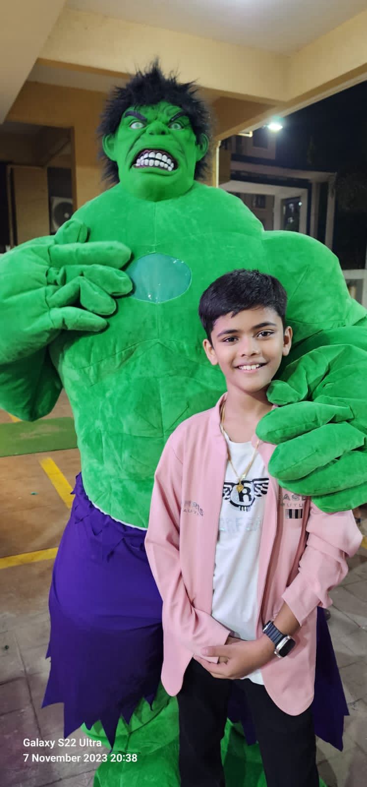 Child enjoying the Hulk mascot at a Toywala event